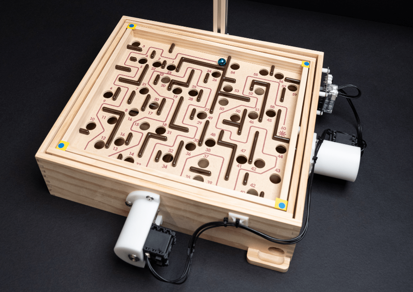 Watch an AI robot learn how to demolish humans at a marble maze game