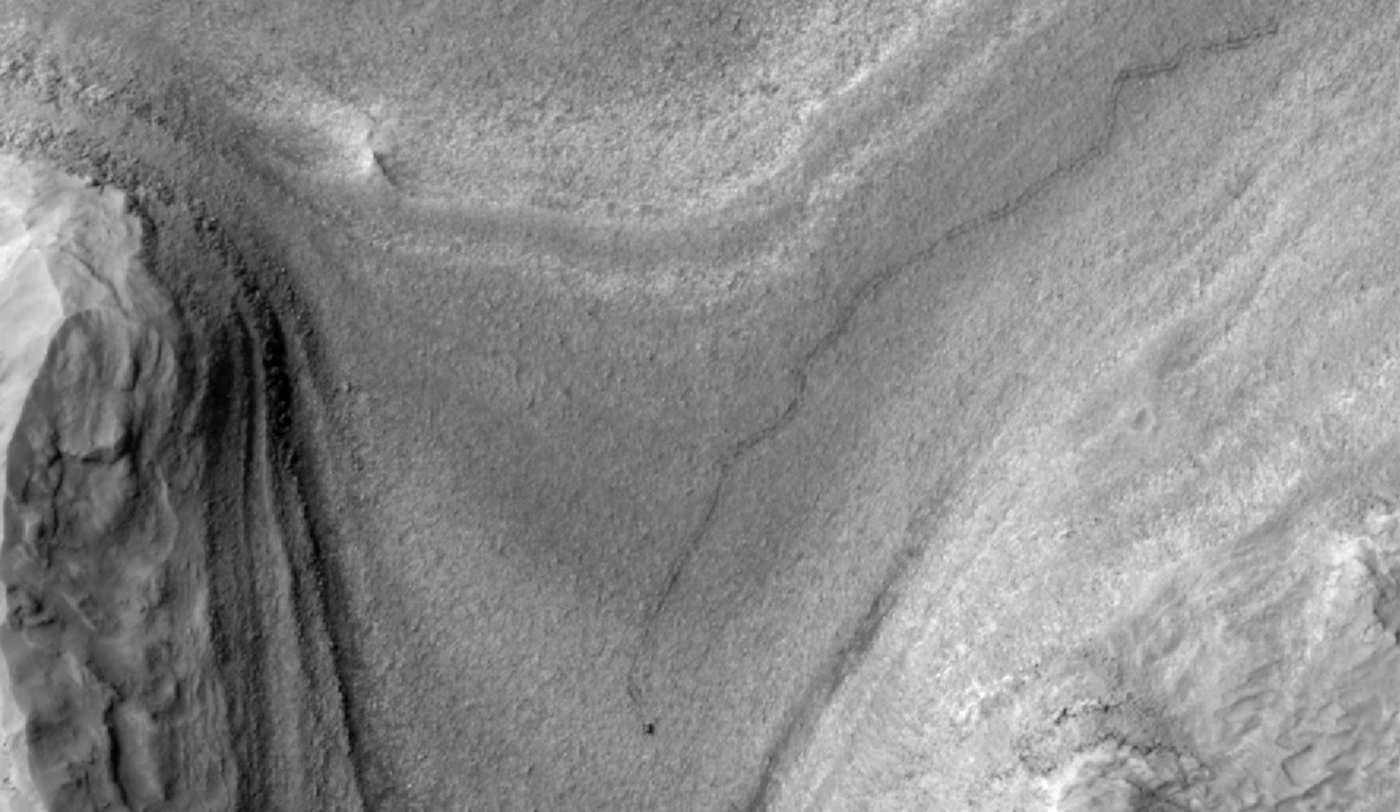 NASA's Mars orbiter snapped this image of Curiosity trucking along down at the surface