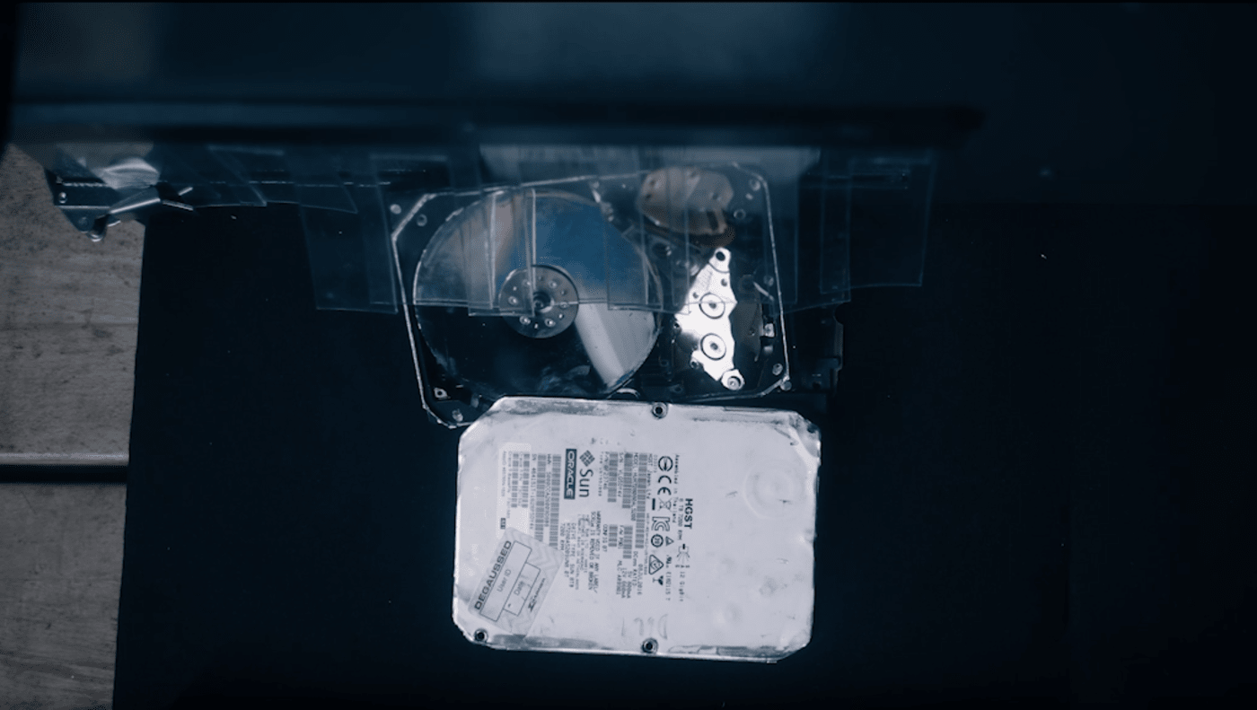 Watch a recycling machine shake apart old hard drives to recover components