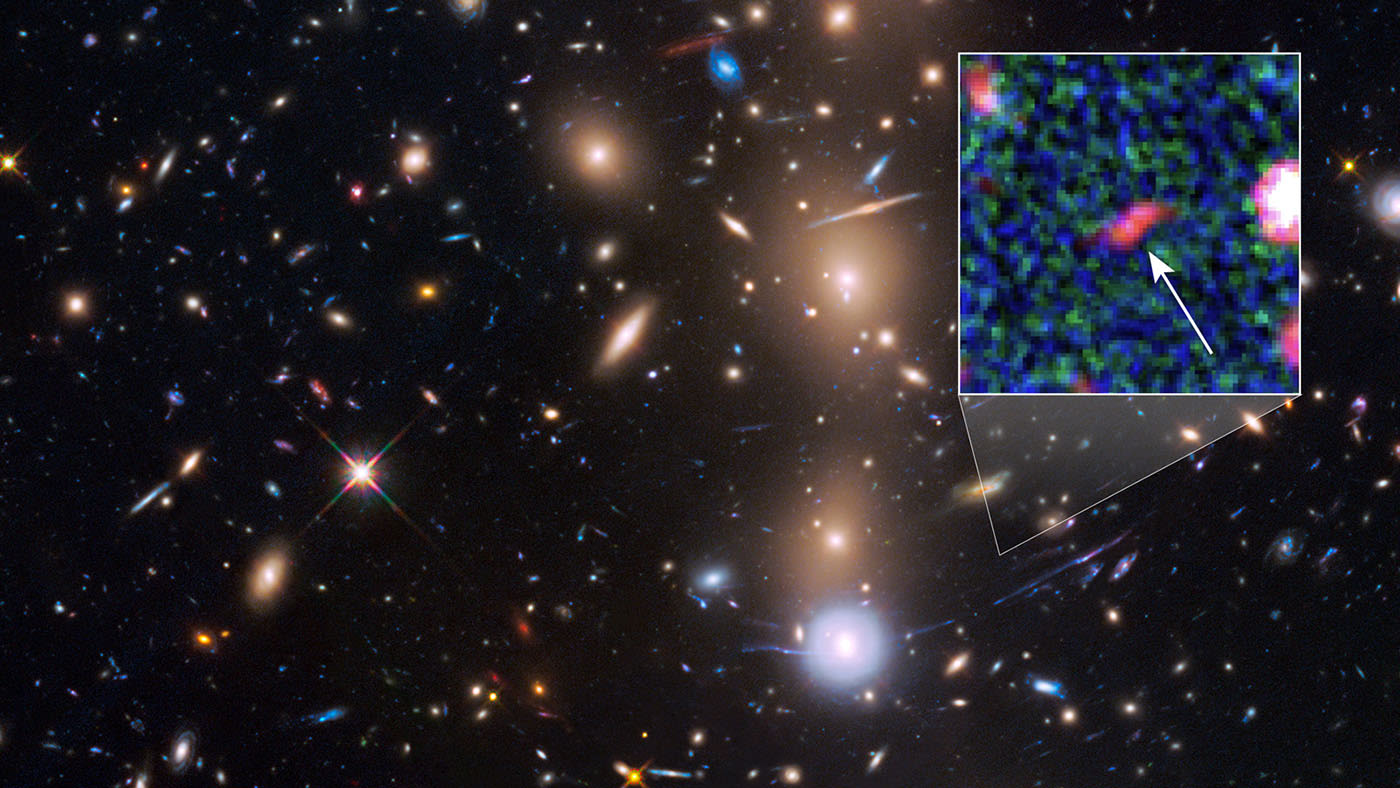 Hubble spots faint galaxy with 'natural magnifying glass'1400 x 788