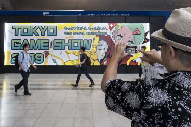 CHIBA, JAPAN - SEPTEMBER 12: An attendee takes a photograph of signage of the Tokyo Game Show 2019 during the business day at Makuhari Messe on September 12, 2019 in Chiba, Japan. The Tokyo Game Show will be open to the public on September 14 and 15, 2019. (Photo by Tomohiro Ohsumi/Getty Images)