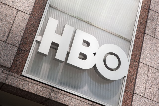 Manhattan, New York USA - July 9, 2011: HBO logo on the HBO Building in New York City, across the street from Bryant Park. HBO is a premium cable specialty channel and is owned by Time Warner.