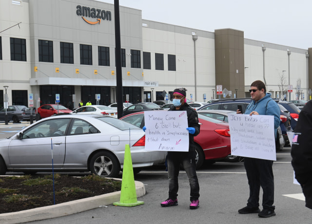 Amazon workers at Amazon's Staten Island warehouse strike in demand that the facility be shut down and cleaned after one staffer tested positive for the coronavirus on March 30, 2020 in New York. - Amazon employees at a New York City warehouse walk off the job March 30, 2020, as a growing number of delivery and warehouse workers demand better pay and protections in the midst of the COVID-19 pandemic. (Photo by Angela Weiss / AFP) (Photo by ANGELA WEISS/AFP via Getty Images)