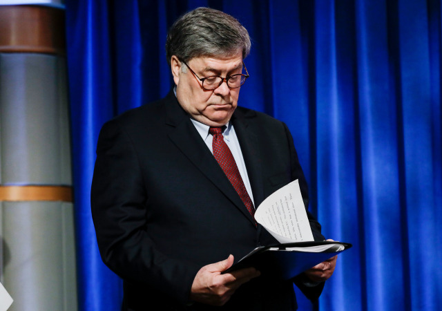 US Attorney General William Barr checks his notes as he arrives for a joint news conference on the International Criminal Court, at the State Department in Washington, DC, on June 11, 2020. - The US on Thursday accused Russia of "manipulating" the International Criminal Court as President Donald Trump announced sanctions against court officials who target US troops. "Foreign powers like Russia are also manipulating the ICC in pursuit of their own agenda," Barr said. (Photo by Yuri Gripas / POOL / AFP) (Photo by YURI GRIPAS/POOL/AFP via Getty Images)