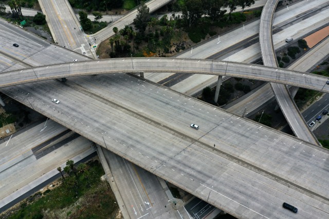 An empty freeway intersection is seen two days before Earth Day, after Los Angeles’ stay-at-home order caused a drop in pollution, as the global outbreak of the coronavirus disease (COVID-19) continues, in Pasadena, near Los Angeles, California, U.S., April 20, 2020. REUTERS/Lucy Nicholson REFILE - CORRECTING LOCATION