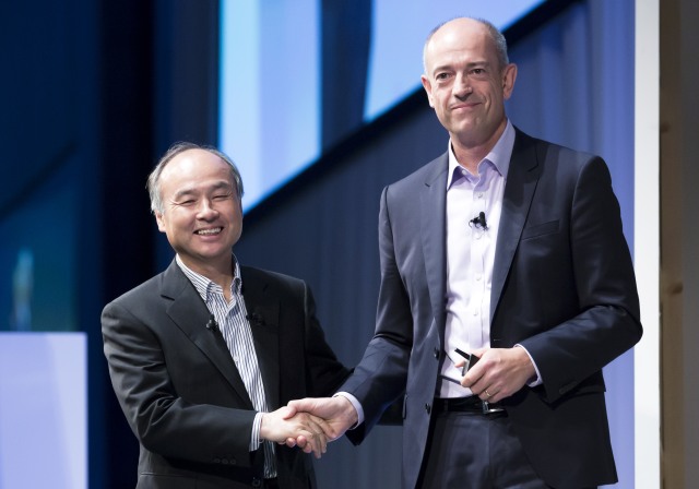 TOKYO, JAPAN - JULY 20: SoftBank Group Corp. Chief Executive Officer Masayoshi Son, left, shakes hands with ARM Holdings Plc Chief Executive Officer Simon Segars during the SoftBank World 2017 conference on July 20, 2017 in Tokyo, Japan. With 70 speeches and sessions, the annual business event hosted by SoftBank, Japan's multinational telecommunications and internet company, takes place for 2 days until July 21. (Photo by Tomohiro Ohsumi/Getty Images)