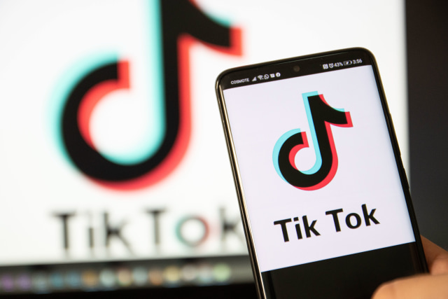 TikTok closeup logo displayed on a phone screen, smartphone and keyboard are seen in this multiple exposure illustration. Tik Tok is a Chinese video-sharing social networking service owned by a Beijing based internet technology company, ByteDance. It is used to create short dance, lip-sync, comedy and talent videos. ByteDance launched TikTok app for iOS and Android in 2017 and earlier in September 2016 Douyin fror the market in China. TikTok became the most downloaded app in the US in October 2018. President of the USA Donald Trump is threatening and planning to ban the popular video sharing app TikTok from the US because of the security risk. Thessaloniki, Greece - August 1, 2020 (Photo by Nicolas Economou/NurPhoto via Getty Images)