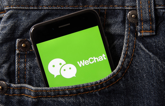 PARIS, FRANCE - SEPTEMBER 18: In this photo illustration the logo of Chinese media app for creating and sharing short videos WeChat is displayed on the screen of a smartphone on September 18, 2020 in Paris, France. The United States on Friday announced a ban on downloading TikTok and WeChat apps, which are very popular with young people, from Sunday, with the two Chinese apps facing accusations of spying for the benefit of China. (Photo Illustration by Chesnot/Getty Images)