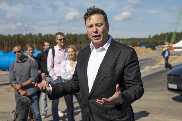 FUERSTENWALDE, GERMANY - SEPTEMBER 03: Tesla head Elon Musk talks to the press as he arrives to have a look at the construction site of the new Tesla Gigafactory near Berlin on September 03, 2020 near Gruenheide, Germany. Musk is currently in Germany where he met with vaccine maker CureVac on Tuesday, with which Tesla has a cooperation to build devices for producing RNA vaccines, as well as German Economy Minister Peter Altmaier yesterday. (Photo by Maja Hitij/Getty Images)