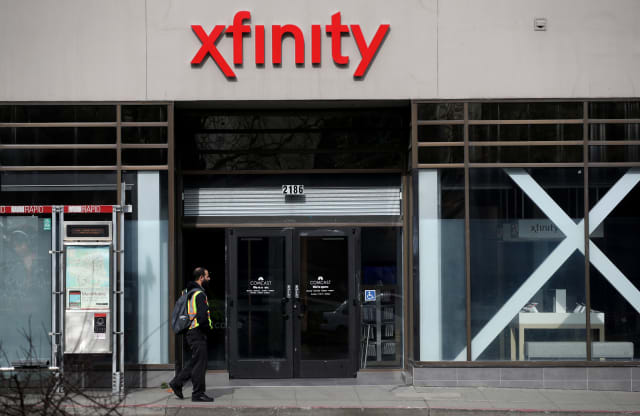 SAN FRANCISCO, CALIFORNIA - JANUARY 23: A pedestrian walks by an Comcast Xfinity retail store on January 23, 2020 in San Francisco, California. Comcast reported a 26 percent surge in fourth quarter earnings with profits of $3.16 billion, or 68 cents per share compared to $2.51 billion, or 55 cents per share, one year ago. (Photo by Justin Sullivan/Getty Images)