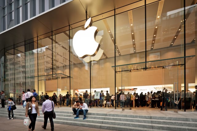 Shanghai, China - October 12, 2011:  Glass entrance to the Apple Store at Nanjing road opened on the September 23, 2011. Many people inside and outside the shop.