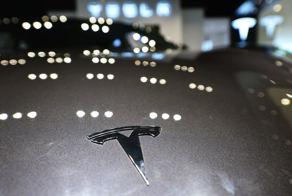 HANGZHOU, CHINA - APRIL 21: A Tesla logo is seen on a vehicle at a Tesla store on April 21, 2020 in Hangzhou, Zhejiang Province of China. (Photo by Long Wei/VCG via Getty Images)
