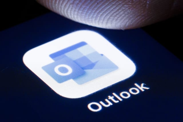 BERLIN, GERMANY - APRIL 22: The logo of the software Microsoft Outlook is shown on the display of a smartphone on April 22, 2020 in Berlin, Germany. (Photo by Thomas Trutschel/Photothek via Getty Images)
