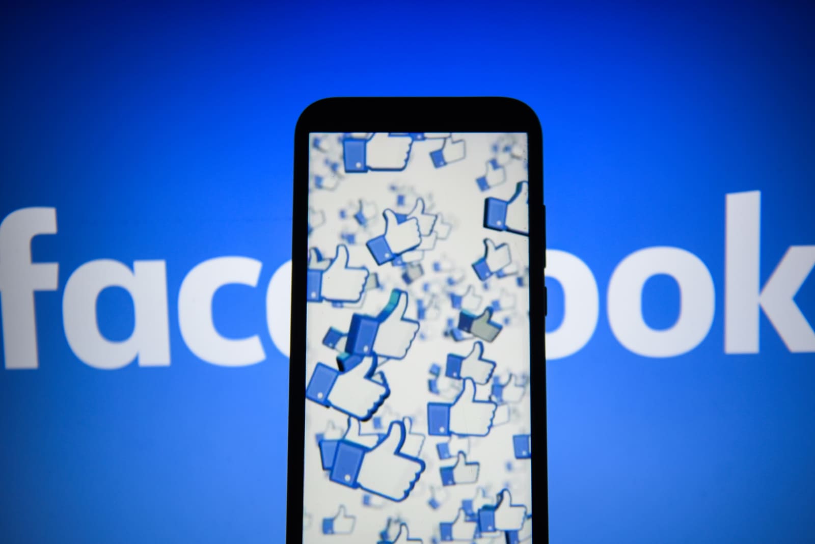 Facebook likes logo are seen on an android mobile phone...