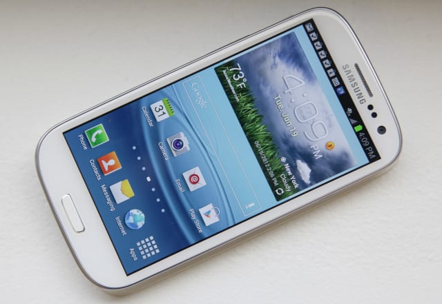This June 19, 2012 photo shows Samsung's new Galaxy S III phone, in New York. The Galaxy S III, which looks and feels like an oversized iPhone, is available next week. (AP Photo/Bebeto Matthews)